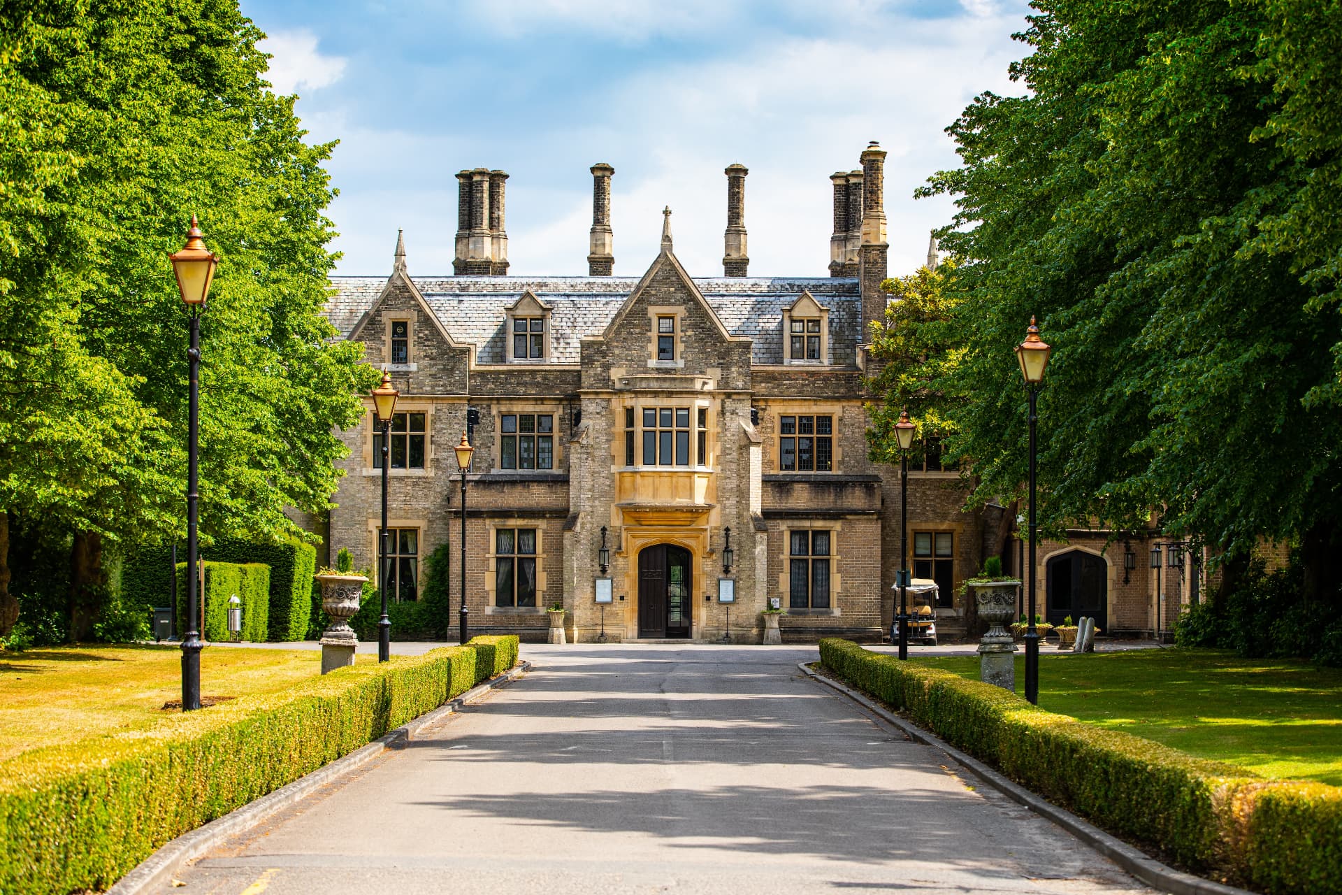 Foxhills — the Basevi-designed Manor House at the end of its lamp-lined drive in Ottershaw, Surrey