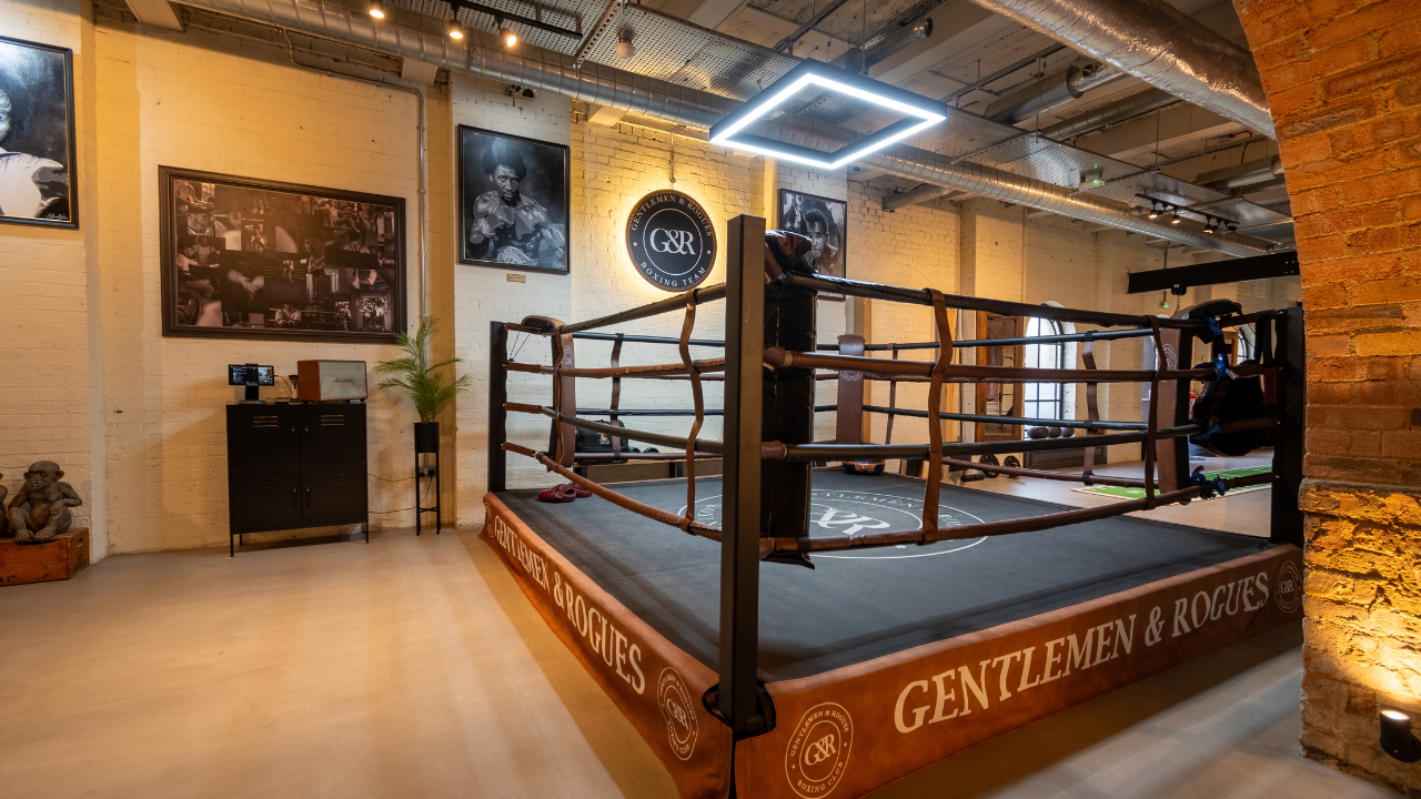 The Gentlemen & Rogues boxing ring beneath exposed brick arches at Old Station Quarter in Peterborough