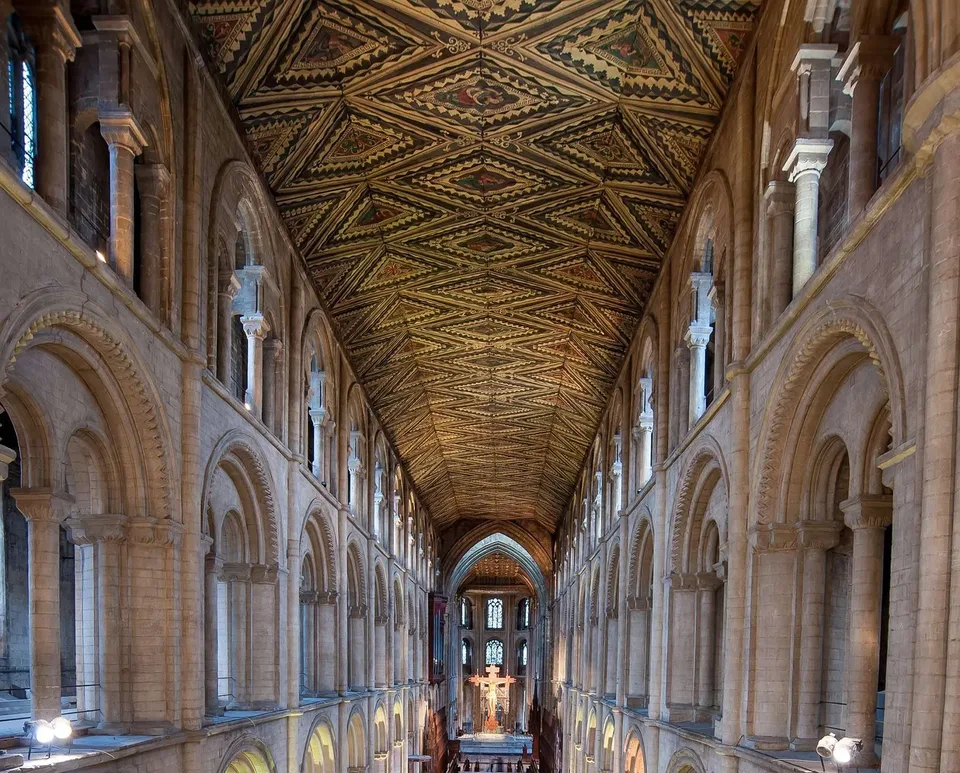 The painted thirteenth-century wooden nave ceiling above the Norman arches of Peterborough Cathedral