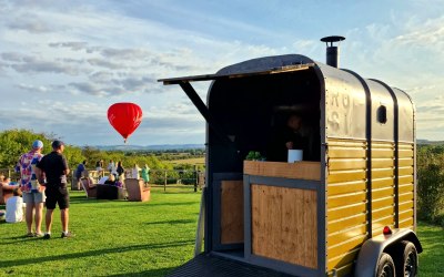 ROSI's converted horse trailer serving at an outdoor event in the North Cotswolds