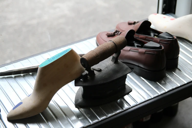 A shoemaking last, iron and finished shoes in Fumu’s Singapore showroom